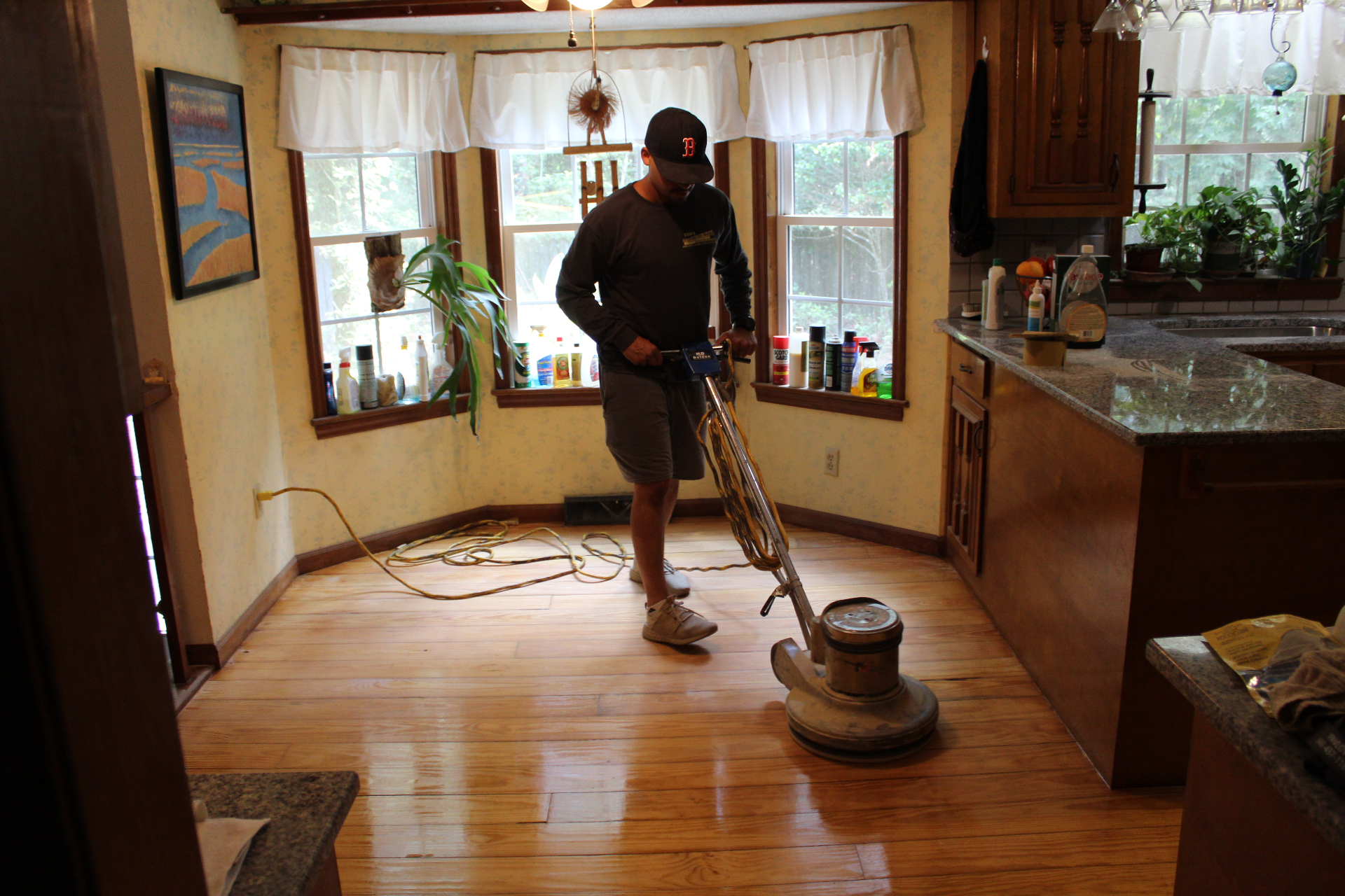 Navarro Hardwood Artistry refinishing a hardwood floor in a Charleston home